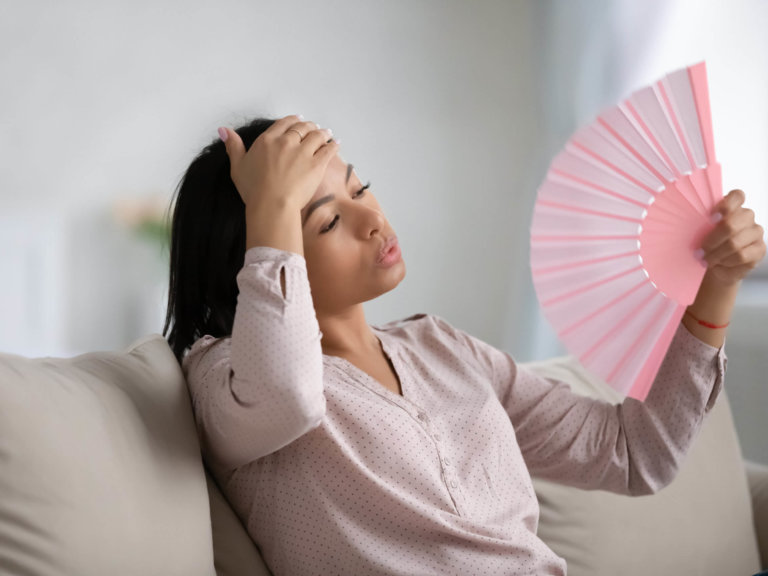 Overheated,Young,African,American,Woman,Relax,On,Sofa,At,Home